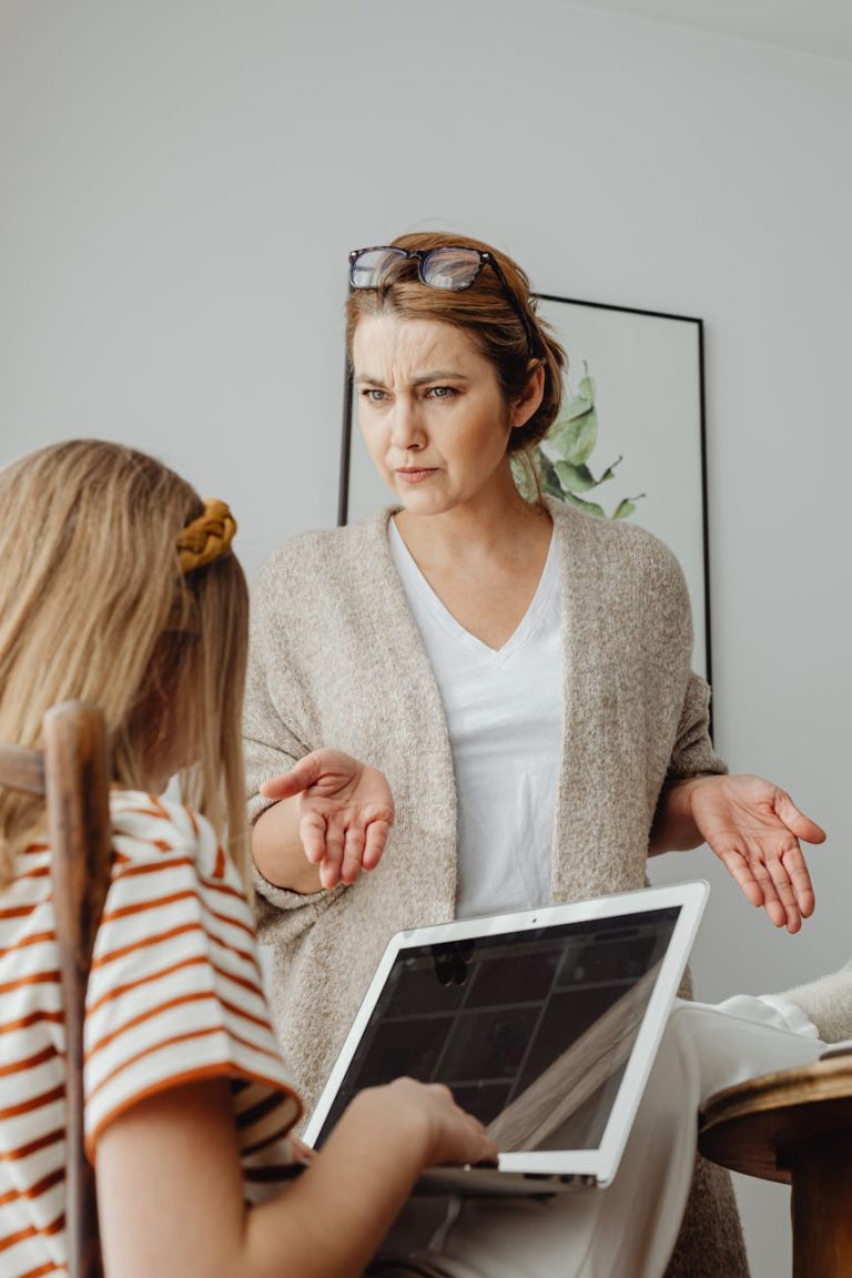 A mother scolds her daughter over tablet usage in a home setting. Tension is visible.